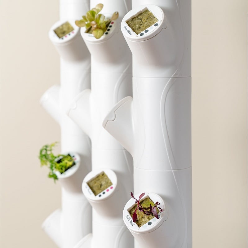 Gardyn Home 2.0 indoor hydroponic garden system with growing plants