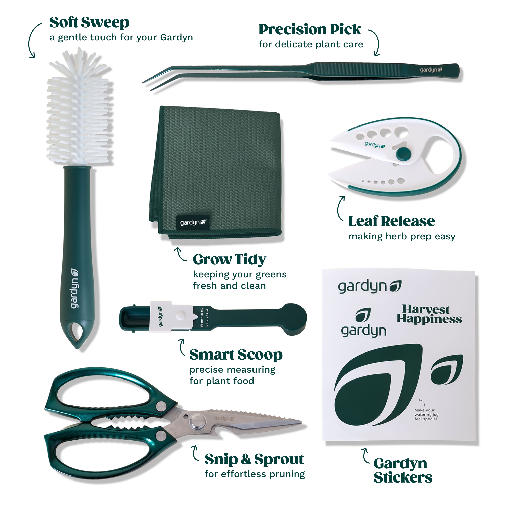 Gardyn Harvest Kit contents - stainless steel scissors, green spray bottle, and cleaning brush