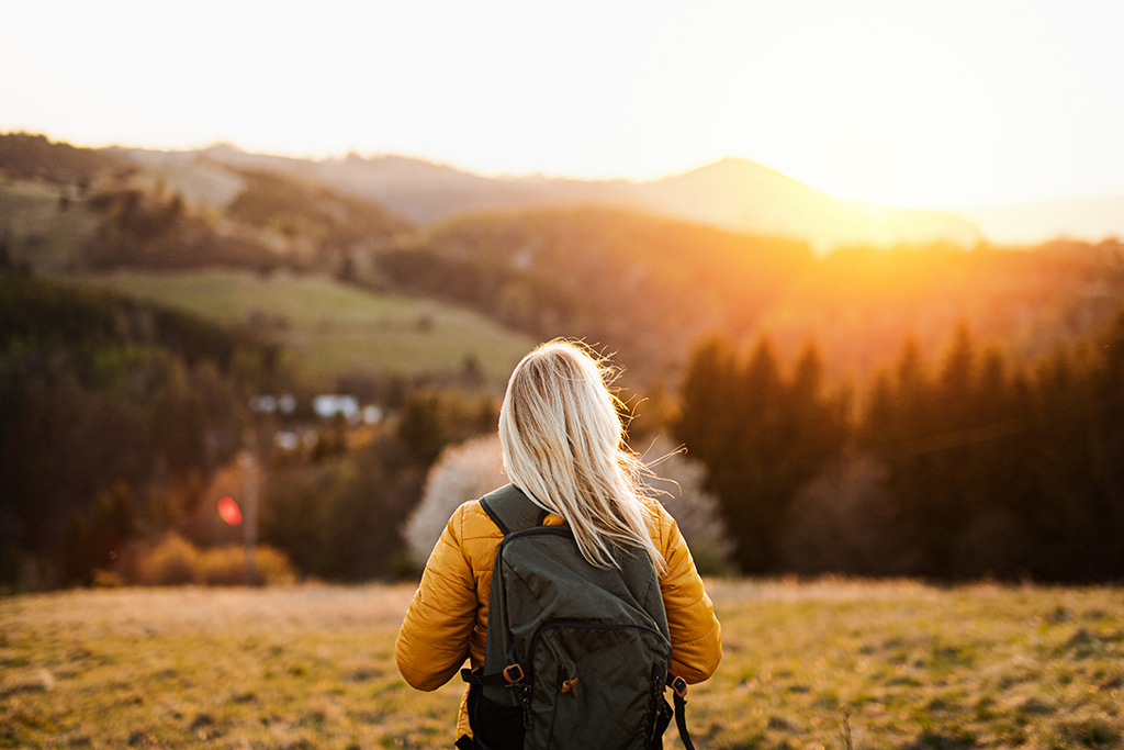 Woman walking outdoors connecting with nature
